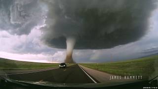 Storm chasing dashcam Tornado crossing the highway Laramie Wyoming [upl. by Nairot644]