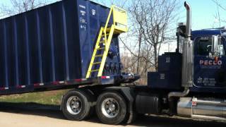 Peterbilt Winch Truck Picking up Frac Tank [upl. by Homans]