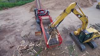 Morbark 6400XT Horizontal Grinder Processing Pallets Stumps and Yard Waste [upl. by Biddy277]