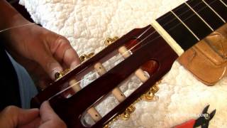 Winding Strings on A Slotted Peghead  Restringing A Classical Guitar [upl. by Eselahc]