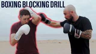 How To Block A Punch  Defensive Blocking Drill [upl. by Aivilo]